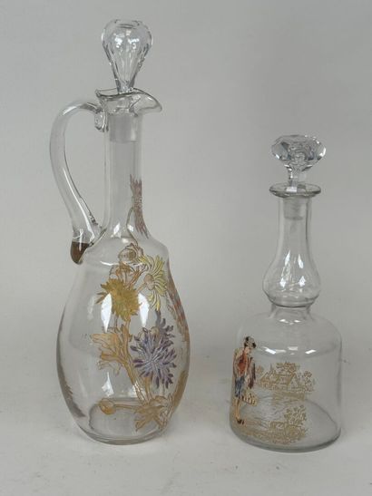 Deux carafes en verre à décor émaillé et...