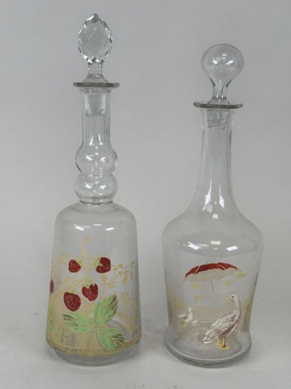 Deux carafes en verre à décor émaillé et...