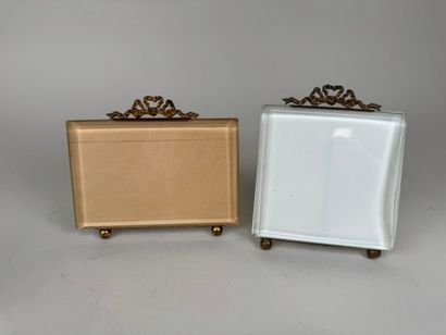 Two beveled glass and brass picture frames...