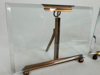 Two beveled glass and brass picture frames.
10...