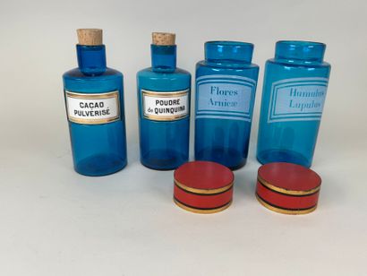 Two pairs of colored glass medicine bottles...
