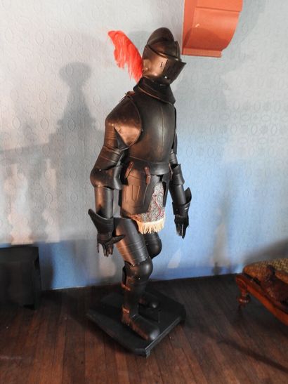 Black patinated and riveted metal armor....