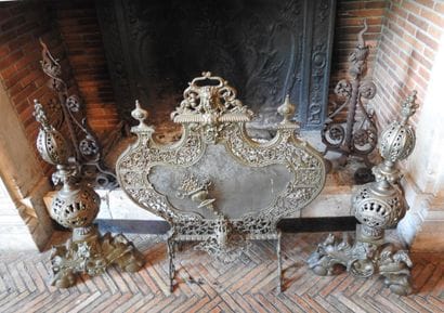Pair of cast brass andirons with openwork...