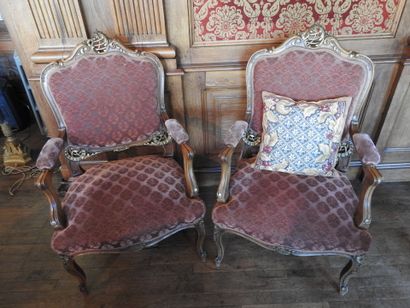 Pair of armchairs in carved and molded wood....