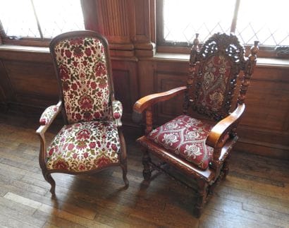 Set of two carved wood armchairs, one Voltaire...