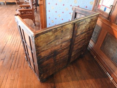 Church bench forming a chest in wood carved...