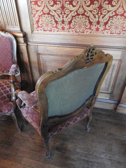 Pair of armchairs in carved and molded wood....