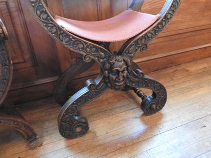 Two curved armchairs in carved wood, leather...