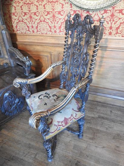 Carved wood armchairs, crook-shaped arms,...