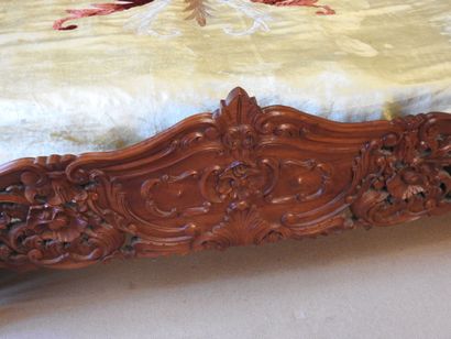 Carved wood bed with openwork decoration....