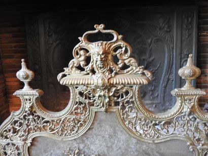 Pair of cast brass andirons with openwork...