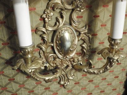 Pair of ormolu two-light sconces. 
Rocaille...