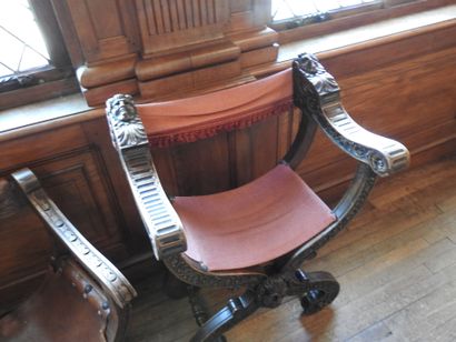 Two curved armchairs in carved wood, leather...