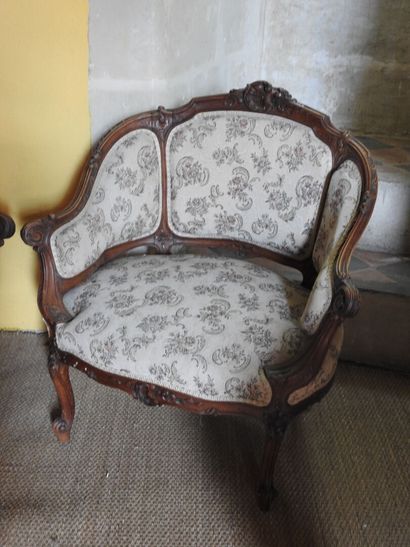 Two carved wood gondola armchairs.
Louis...