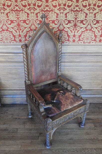 Gothic-style armchair in wood, leather seat....