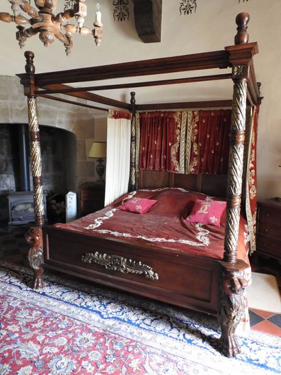 Large canopy bed in wood carved with lion...