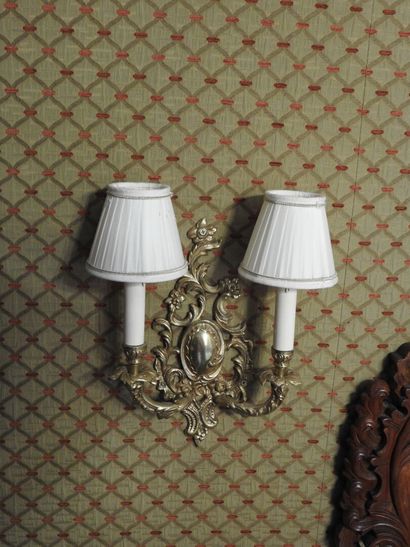 Pair of ormolu two-light sconces. 
Rocaille...