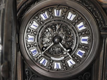 Partially openwork bronze clock, the enameled...