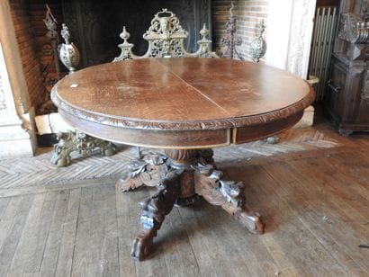Carved oak oval middle table resting on four...