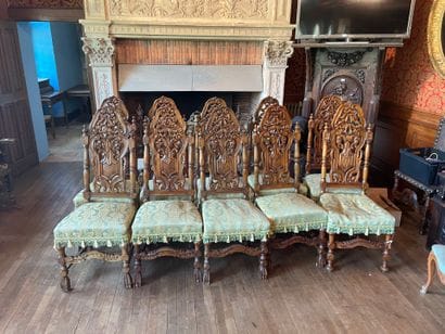 Suite of ten Henri II style chairs in carved...