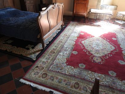 Two mechanical carpets with a red background...
