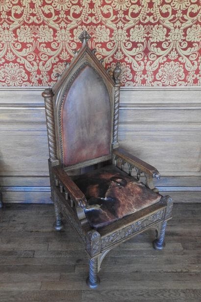 Gothic-style armchair in wood, leather seat....