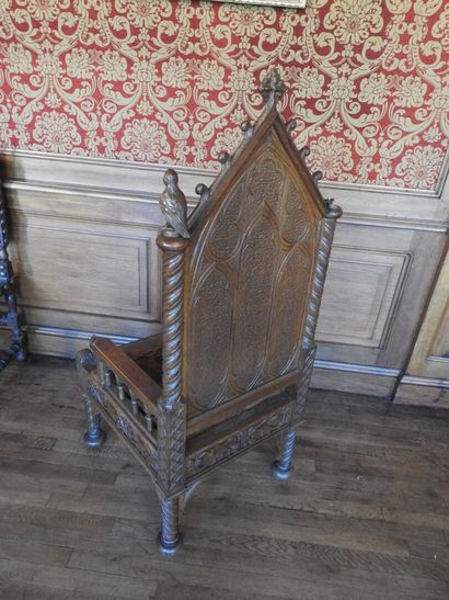 Gothic-style armchair in wood, leather seat....