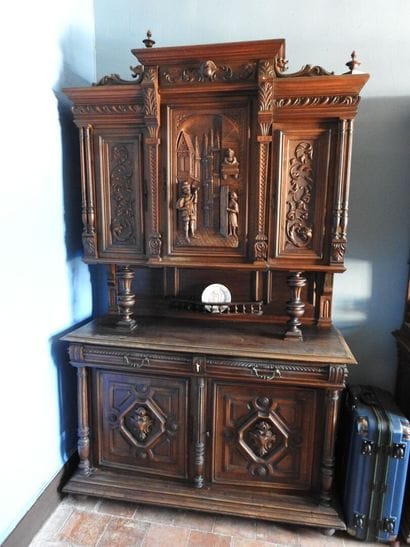 Carved wood sideboard with three doors on...