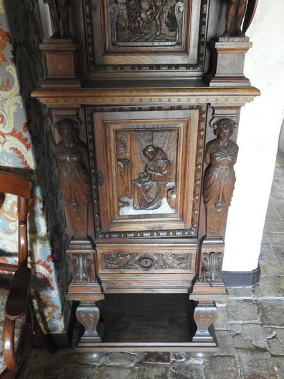 Carved wood cabinet with two doors and a...