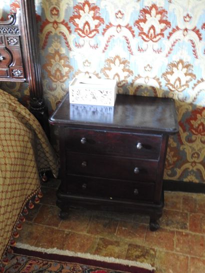 Large carved wood bed decorated with women...