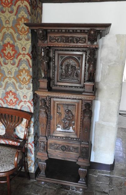Carved wood cabinet with two doors and a...