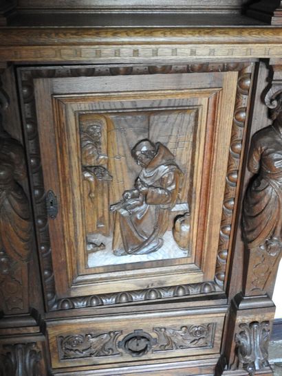 Carved wood cabinet with two doors and a...