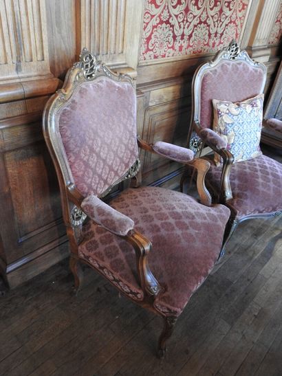 Pair of armchairs in carved and molded wood....