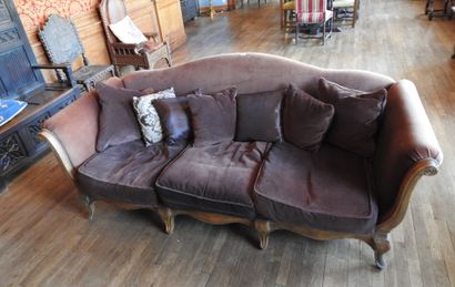 Carved oak three-seater sofa on eight legs....