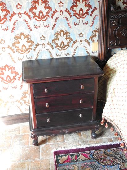 Large carved wood bed decorated with women...