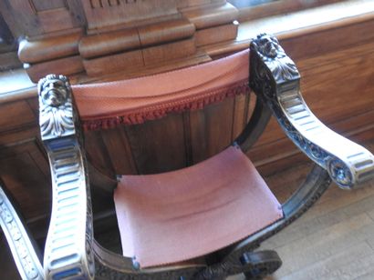 Two curved armchairs in carved wood, leather...