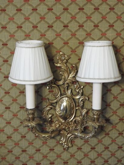Pair of ormolu two-light sconces. 
Rocaille...