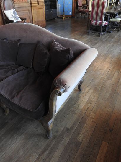 Carved oak three-seater sofa on eight legs....