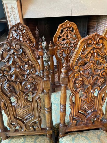 Suite of ten Henri II style chairs in carved...