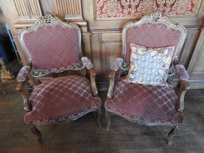 Pair of armchairs in carved and molded wood....
