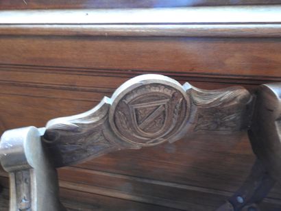 Two curved armchairs in carved wood, leather...