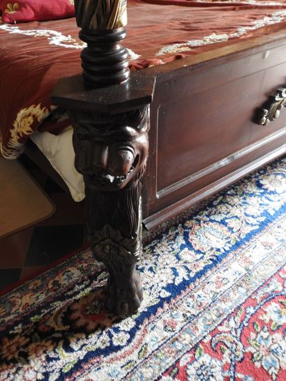 Large canopy bed in wood carved with lion...