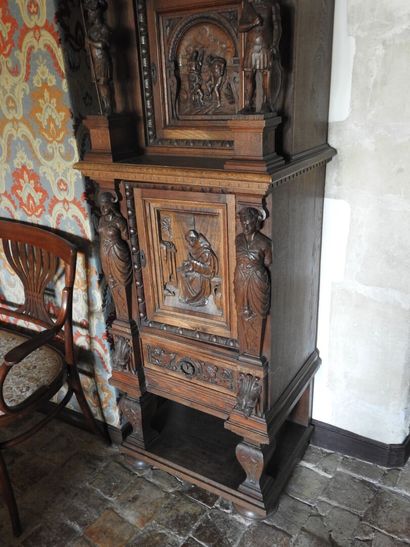 Carved wood cabinet with two doors and a...