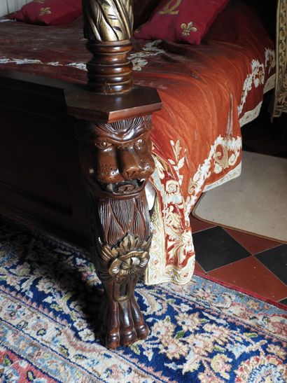 Large canopy bed in wood carved with lion...