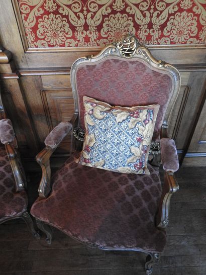 Pair of armchairs in carved and molded wood....