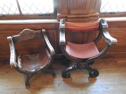 Two curved armchairs in carved wood, leather...