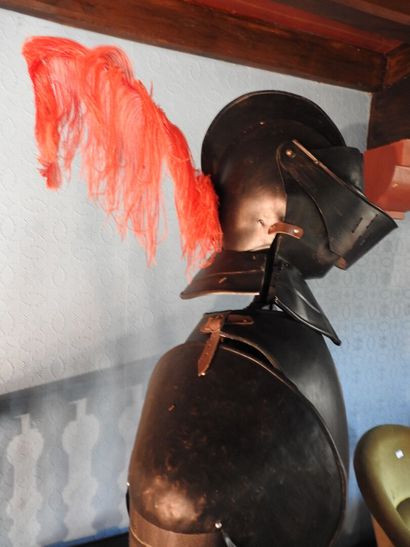 Black patinated and riveted metal armor....