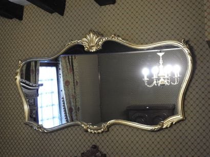 Large molded and gilded wood mirror. 
Rocaille...