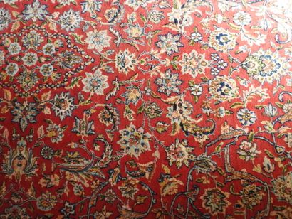 Polychrome wool hand-knotted rug decorated...