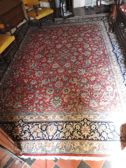 Polychrome wool hand-knotted rug decorated...